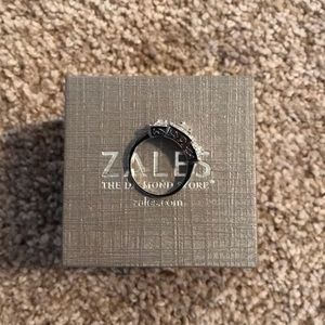 White sapphire three stone engagement ring